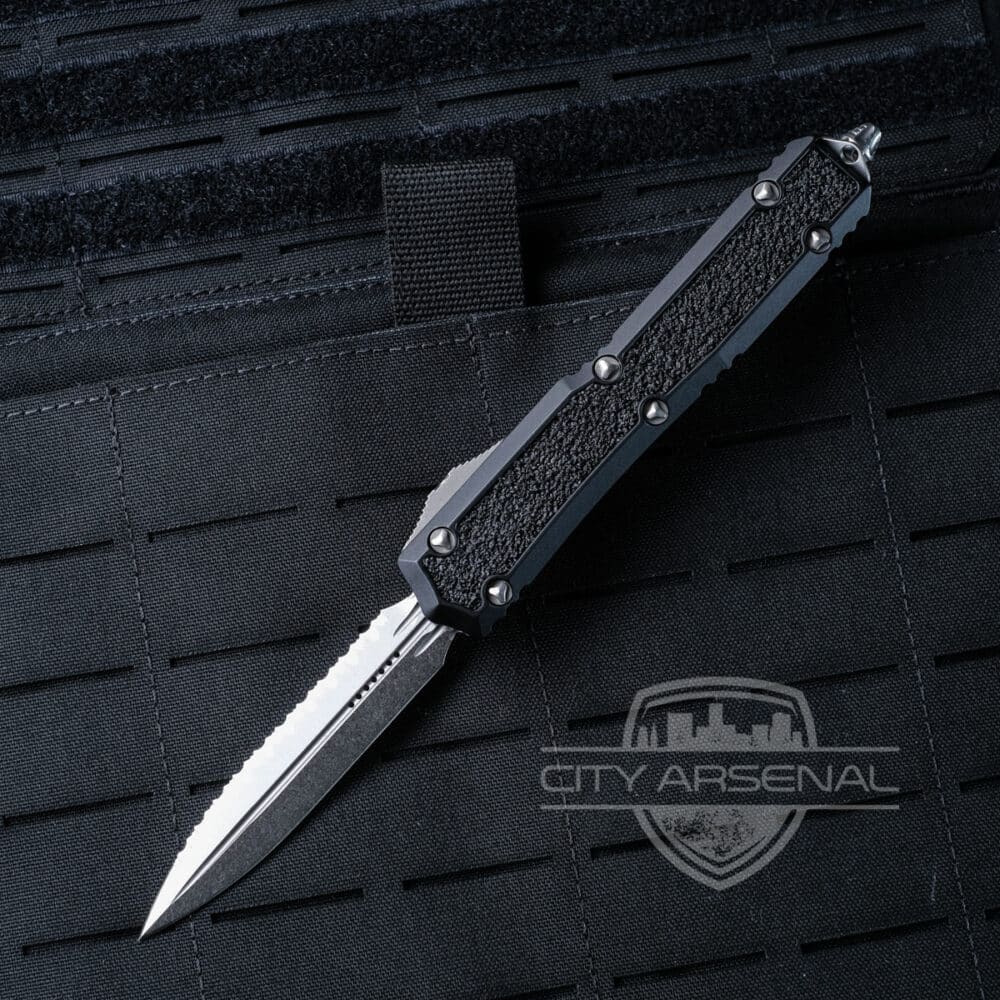 Microtech Makora Signature Series OTF Auto Knife, Double Edge Serrated/Plain Blade, Black Handles (206-12S)