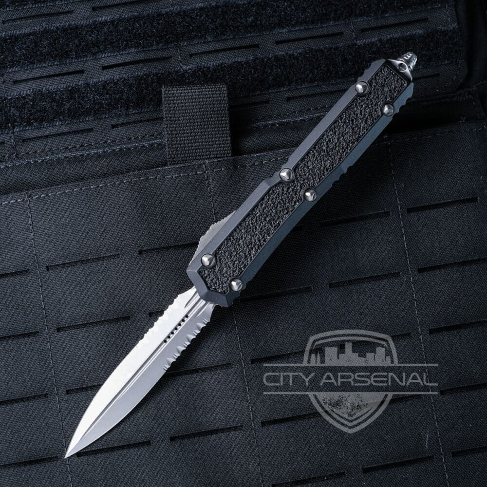 Microtech Makora Signature Series OTF Auto Knife, Stonewash D/E Blade, Partial Serrated, Black Handles (206-11S)